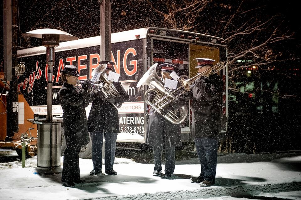 A band serenades in the snow